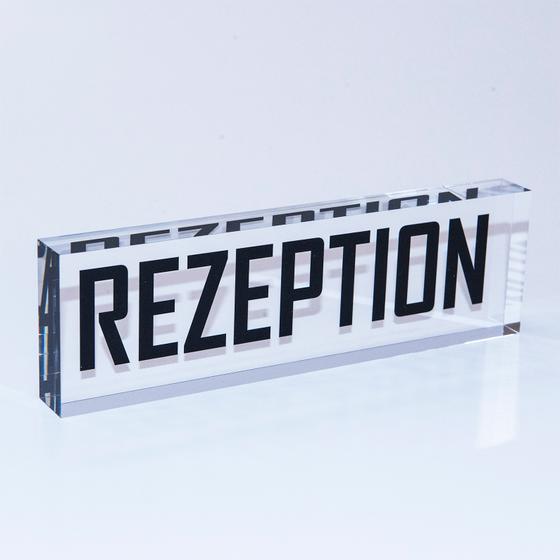 Solid PLEXIGLAS® block with "Reception" imprint
